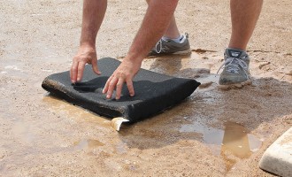Gently press puddle sponge to absorb puddle water