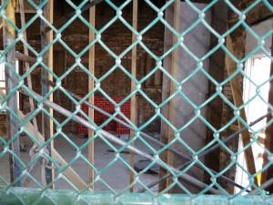 It was built in the nineteen teens, it had six rooms. It has been moved around but is to be put back into it’s original place. The home had 6 rooms. Surprisingly, when tested for lead paint recently for the renovation, the test results came back negative. The glowing red brick looks fake but is very real.